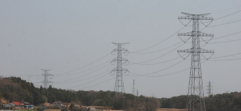 Transmission towers and cables over fields