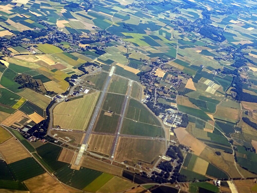 Aerial view of a base with runways and fields