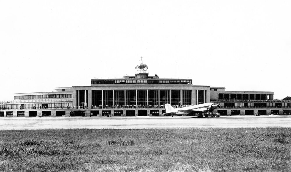 Airport terminal seen from the runway, in an old photo