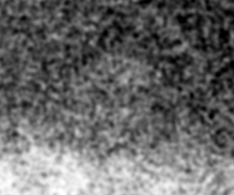 The same crop showing only the light, smoothed: a rounded light shape above the light band of the wall